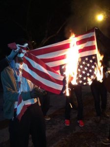 FERGUSON EXPLODING AGAIN! PROTESTERS TARGET WEALTHY WHITES, VANDALIZE HOME, BURN US FLAGS, ASSAULT REPORTER, CALL FOR OFFICER’S DEATH